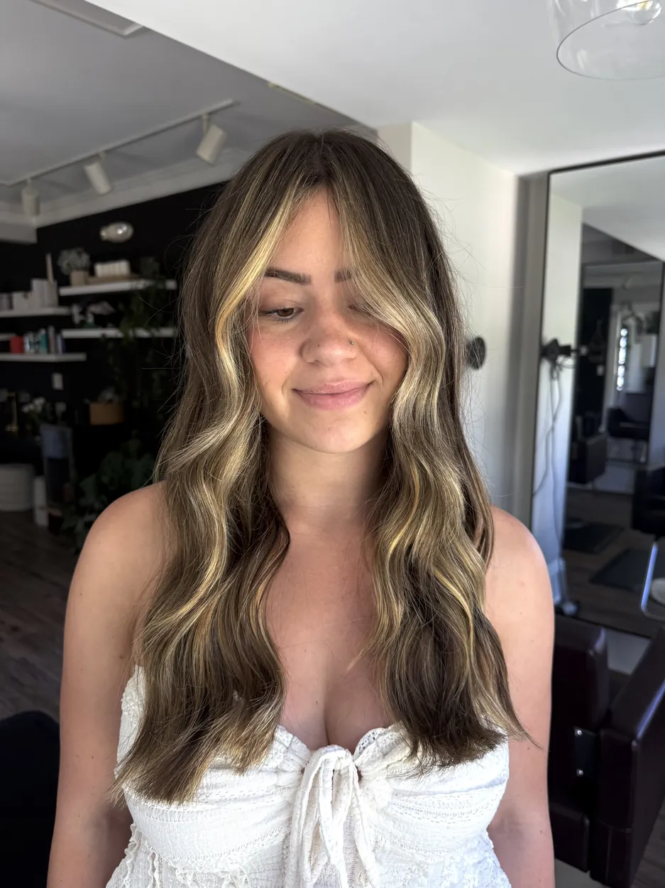 Brunette with blonde face-framing money pieces and curtain bangs by hairxlaina, Northville MI