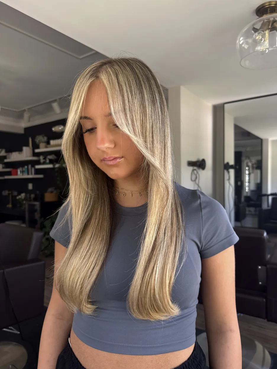 Sleek straight bronde blowout with bright face-framing highlights by hairxlaina