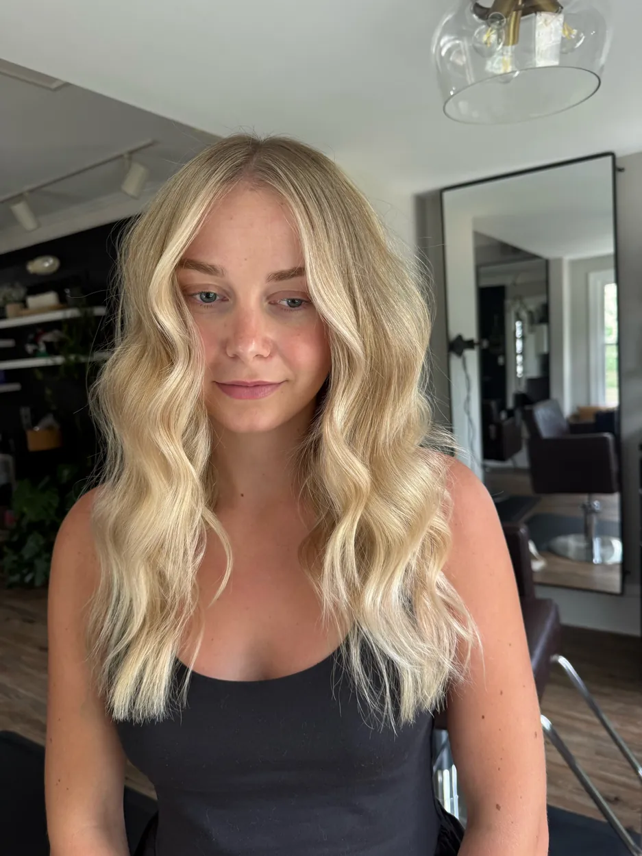 Bright golden blonde with soft waves and a lived-in root by hairxlaina, Northville MI